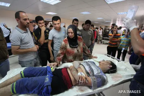 Palestinian man, who medics said was wounded by Israeli shelling, brought to Al-Shifa hospital in Gaza City July 23, 2014. Israeli forces pounded multiple sites across the Gaza Strip on Wednesday, including the enclave's...