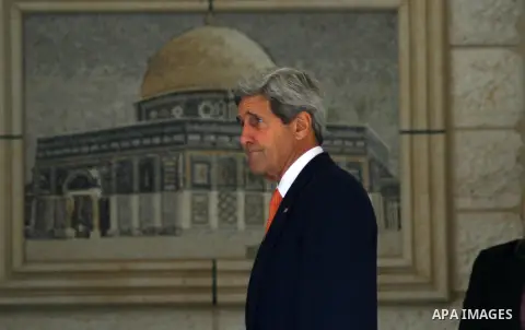 U.S. Secretary of State John Kerry arrives at a meeting with Palestinian President Mahmoud Abbas in the West Bank city of Ramallah, Wednesday, July 23, 2014. Kerry is meeting with U.N. Secretary-General Ban Ki-moon, Isra...