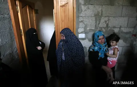 Palestinian relatives of Tawfiq al-Agha, who medics said was killed in Israeli shelling, mourn during his funeral in Khan Younis in the southern Gaza Strip July 23, 2014. Israeli forces pounded Gaza on Wednesday, meeting...