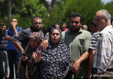 A woman overcome by emotion weeps after seeing the body of a loved one, on the sixteenth day of the war in Gaza, at the Shifa hospital morgue, in Gaza City, Wednesday, July 23, 2014. Offering the first glimmer of hope fo...