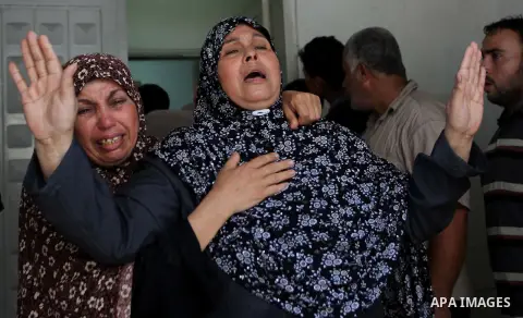 A woman overcome by emotion weeps after seeing the body of a loved one, on the sixteenth day of the war in Gaza, at the Shifa hospital morgue, in Gaza City, Wednesday, July 23, 2014. Offering the first glimmer of hope fo...