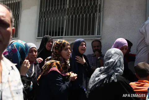 A woman overcome by emotion weeps after seeing the body of a loved one, on the sixteenth day of the war in Gaza, at the Shifa hospital morgue, in Gaza City, Wednesday, July 23, 2014. Offering the first glimmer of hope fo...
