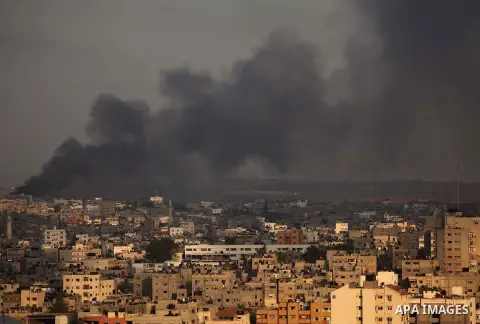 Smoke rises from buildings following an Israeli airstrike in eastern Gaze City neighbourhood of Shejaiya during a military operation on July 23, 2014. A series of strikes and shellings throughout Gaza brought the total n...
