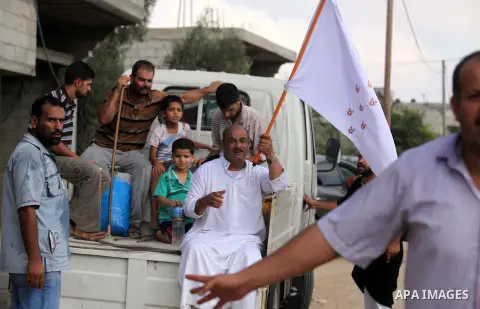 Palestinian families leave their neighborhood to a safer location as Israel's army continues shelling the area of Khan Yunis, in the southern Gaza Strip, on July 24, 2014. Seven Palestinians were killed in a series of st...