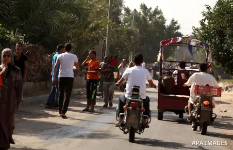 Palestinian families leave their neighborhood to a safer location as Israel's army continues shelling the area of Khan Yunis, in the southern Gaza Strip, on July 24, 2014. Seven Palestinians were killed in a series of st...