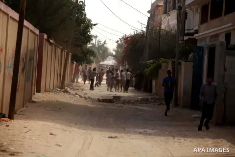 Palestinian families leave their neighborhood to a safer location as Israel's army continues shelling the area of Khan Yunis, in the southern Gaza Strip, on July 24, 2014. Seven Palestinians were killed in a series of st...