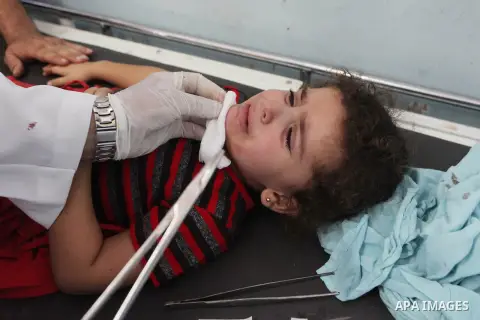 Palestinians wheel a stretcher transporting a girl, who medics said was wounded by an Israeli air strike, at a hospital in Khan Younis in the southern Gaza Strip July 24, 2014. Israel won a partial reprieve from the econ...