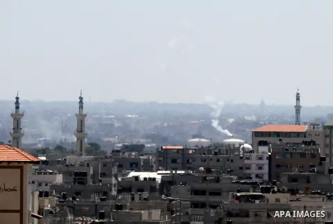 Smoke from an Israeli strike rises over the Gaza Strip, Friday, July 25, 2014. Israeli warplanes struck houses throughout the Gaza Strip as international efforts continue to broker a cease fire in the 18 day-old war. Pho...