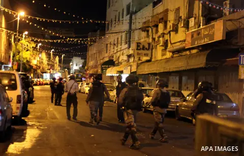 Israeli policemen stand guard as they barring entrance to the al-Aqsa mosque to men younger than 50 years, to mark Laylat al-Qadr, or Night of Destiny, in Jerusalem's Old City on July 24, 2014. On Friday, dozens of Pales...