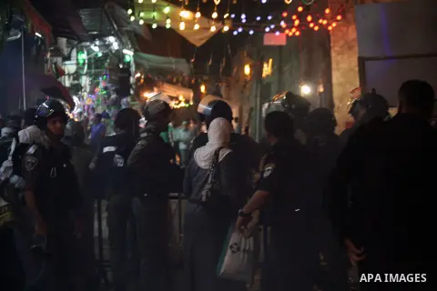 Israeli policemen stand guard as they barring entrance to the al-Aqsa mosque to men younger than 50 years, to mark Laylat al-Qadr, or Night of Destiny, in Jerusalem's Old City on July 24, 2014. On Friday, dozens of Pales...