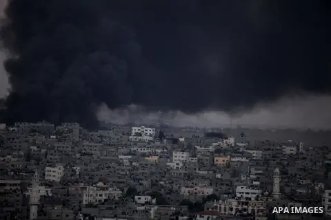 Smoke billows from a building hit by an Israeli air strike in Gaza City on July 25, 2014. Israel rejected a Gaza ceasefire proposal presented by US Secretary of State John Kerry, Israeli public television reported.. Phot...