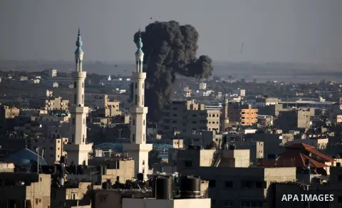 Smoke billows from a building hit by an Israeli air strike in Gaza City on July 25, 2014. Israel rejected a Gaza ceasefire proposal presented by US Secretary of State John Kerry, Israeli public television reported.. Phot...