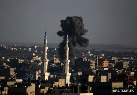 Smoke billows from a building hit by an Israeli air strike in Gaza City on July 25, 2014. Israel rejected a Gaza ceasefire proposal presented by US Secretary of State John Kerry, Israeli public television reported.. Phot...