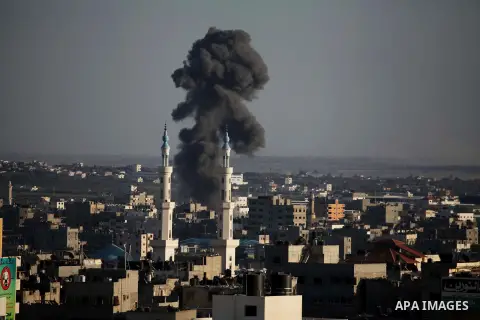 Smoke billows from a building hit by an Israeli air strike in Gaza City on July 25, 2014. Israel rejected a Gaza ceasefire proposal presented by US Secretary of State John Kerry, Israeli public television reported.. Phot...