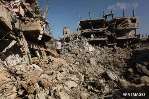 Palestinians inspect the rubble of destroyed houses in the Shejaia neighbourhood, which witnesses said was heavily hit by Israeli shelling and air strikes during an Israeli offensive, in Gaza City July 26, 2014. A 12-hou...