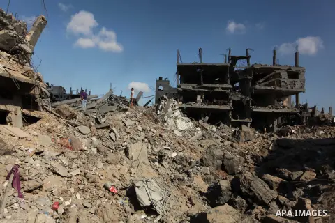 Palestinians inspect the rubble of destroyed houses in the Shejaia neighbourhood, which witnesses said was heavily hit by Israeli shelling and air strikes during an Israeli offensive, in Gaza City July 26, 2014. A 12-hou...