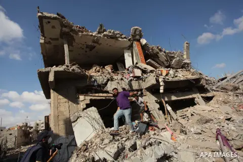Palestinians inspect the rubble of destroyed houses in the Shejaia neighbourhood, which witnesses said was heavily hit by Israeli shelling and air strikes during an Israeli offensive, in Gaza City July 26, 2014. A 12-hou...