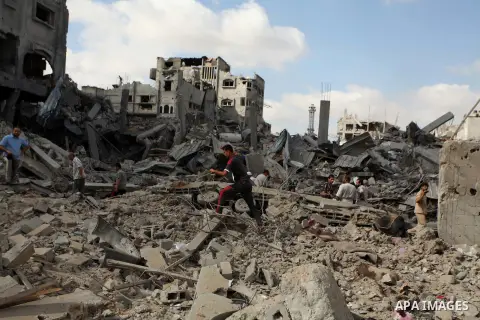 Palestinians inspect the rubble of destroyed houses in the Shejaia neighbourhood, which witnesses said was heavily hit by Israeli shelling and air strikes during an Israeli offensive, in Gaza City July 26, 2014. A 12-hou...