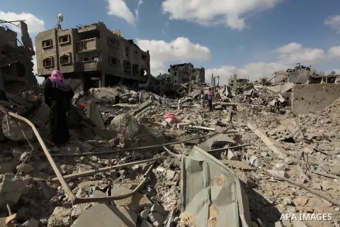 Palestinians inspect the rubble of destroyed houses in the Shejaia neighbourhood, which witnesses said was heavily hit by Israeli shelling and air strikes during an Israeli offensive, in Gaza City July 26, 2014. A 12-hou...