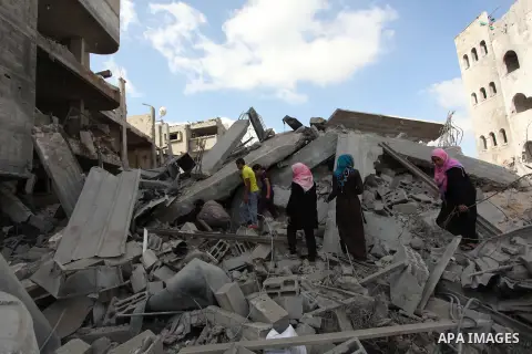 Palestinians inspect the rubble of destroyed houses in the Shejaia neighbourhood, which witnesses said was heavily hit by Israeli shelling and air strikes during an Israeli offensive, in Gaza City July 26, 2014. A 12-hou...