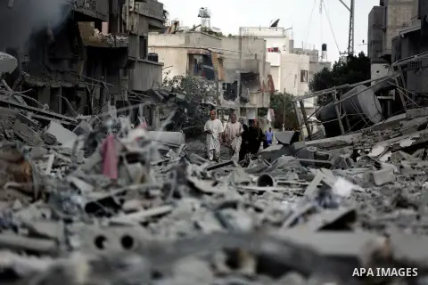 Palestinians inspect the rubble of destroyed houses in the Shejaia neighbourhood, which witnesses said was heavily hit by Israeli shelling and air strikes during an Israeli offensive, in Gaza City July 26, 2014. A 12-hou...