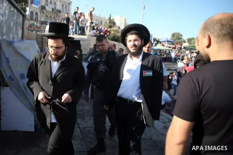 Israeli policemen detain members of Neturei Karta Jews protesters during a protest against the Israeli offensive on the Gaza Strip, in front of Damascus gate in Jerusalem's Old City July 27, 2014. Palestinian medics said...