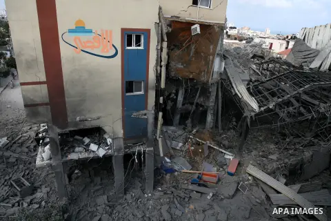 Rubble lies around the Al Aqsa television building that was destroyed in an Israeli strike in central Gaza City on July 29, 2014. Following two nights without air strikes, the violence returned to Gaza's skies overnight,...