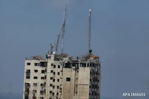 This picture shows the destroyed rooftop of the media complex that houses the offices of Hamas-run Al Aqsa television and radio after it was targeted in an Israeli strike in central Gaza City early on Tuesday, July 29, 2...