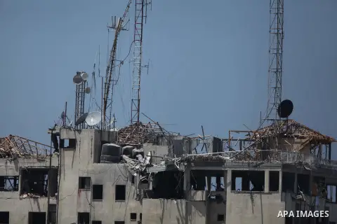 This picture shows the destroyed rooftop of the media complex that houses the offices of Hamas-run Al Aqsa television and radio after it was targeted in an Israeli strike in central Gaza City early on Tuesday, July 29, 2...