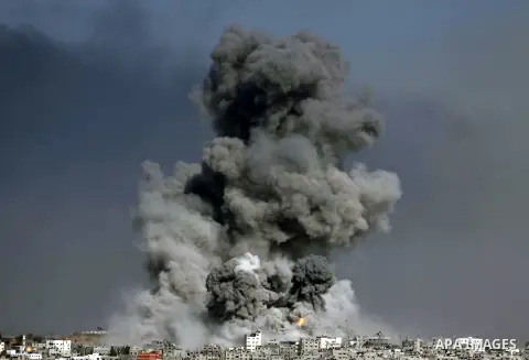 Smoke from the explosion of an Israeli strike rise over Gaza City, Tuesday, July 29, 2014. Israel escalated its military campaign against Hamas on Tuesday, striking symbols of the group's control in Gaza and firing tank...