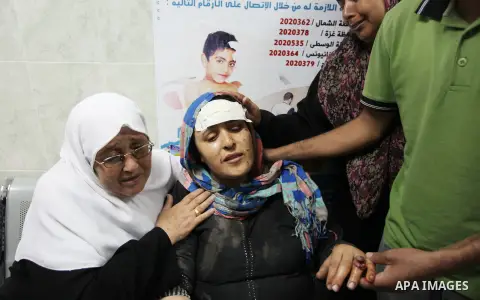 Palestinians who lost relatives in an Israeli strike on a compound housing a UN school in Jabalia refugee camp in the northern Gaza Strip, cry outside the Kamal Edwin hospital in Beit Lahia where victims from the attack...