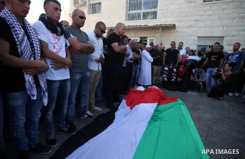 Palestinians mourns two body of Zehir Al-Najar 7, and Ahmed Abu Baler 19, from the Gaza Strip, during thier funeral in East Jerusalem, on July 30, 2014 after they died from injuries sustained following an Israeli militar...