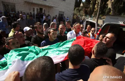 Palestinians mourns two body of Zehir Al-Najar 7, and Ahmed Abu Baler 19, from the Gaza Strip, during thier funeral in East Jerusalem, on July 30, 2014 after they died from injuries sustained following an Israeli militar...