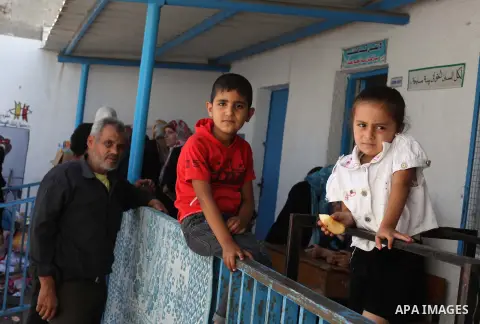 Displaced Palestinian children take shelter at the Abu Hussien UN school in the Jabalia refugee camp in the northern Gaza Strip after the area was hit earlier in the morning by Israeli shelling on July 30, 2014. Israeli...