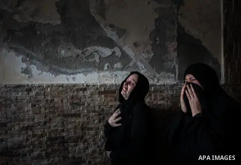 Palestinian relatives of Mohammed al-Daeri, 25, mourn during his funeral in Gaza City on July 31, 2014. At least 10 people were killed in Israeli strikes on central and southern Gaza bringing the Palestinian death toll t...