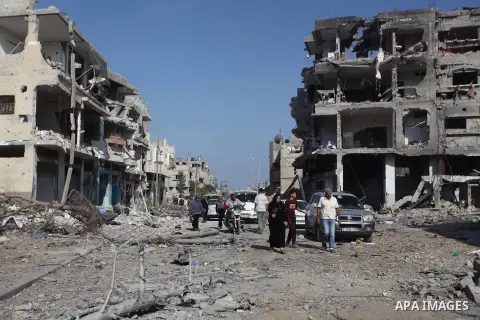 Palestinians who were displaced from their houses due fighting between Israel's army and Hamas fighters return to check their homes in Gaza City's Shejaiya neighbourhood, on August 1, 2014. Israeli shelling killed eight...