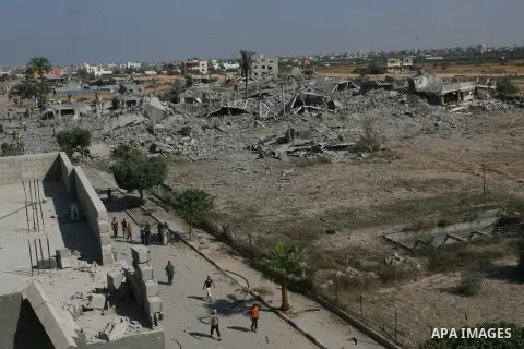 Palestinians walk among the rubble of destroyed houses in the east of Khan Younis, which witnesses said was heavily hit by Israeli shelling and air strikes during an Israeli offensive, in the southern Gaza Strip August 1...