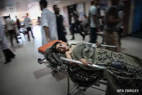 A Palestinian, boy whom medics said was wounded in an Israeli air strike at a hospital in Gaza City July 31, 2014. Israeli Prime Minister Benjamin Netanyahu, facing international alarm over a rising civilian death toll i...