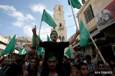 Palestinian Hamas supporters shout slogans against Israel during a protest to support Hamas and against the Israeli attack to Gaza strip in the West Bank city of Nablus, 04 August 2014. Israel will not end its offensive...