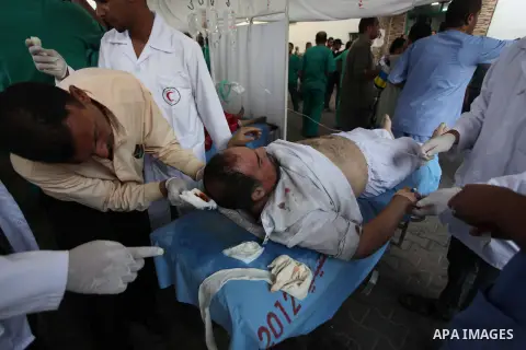 Palestinian medics treat a man, whom medics said was wounded in an Israeli air strike, at a hospital in Rafah in the southern Gaza Strip August 4, 2014. A brief Israeli truce to allow aid to reach Palestinians ended on M...