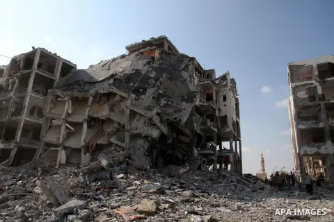 Palestinians inspect a destroyed houses as they return to their house in Beit Lahiya town, which witnesses said was heavily hit by Israeli shelling and air strikes during the Israeli offensive, in the northern Gaza Strip...
