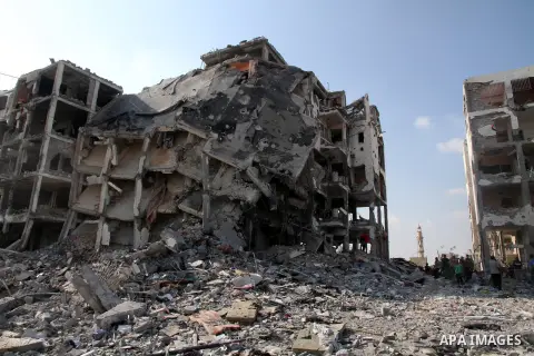 Palestinians inspect a destroyed houses as they return to their house in Beit Lahiya town, which witnesses said was heavily hit by Israeli shelling and air strikes during the Israeli offensive, in the northern Gaza Strip...