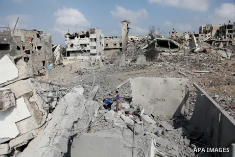 Palestinians inspect destroyed houses and the area where the Al-Wafaa hospital stood in the Al-Shejaea neighbourhood of Gaza City on August 5, 2014, after a 72-hour truce agreed by Israel and Hamas went into effect follo...