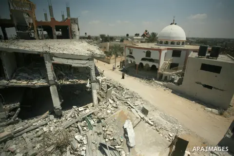 Palestinians search through rubble of their destroyed houses hit by Israeli strikes in Khuzaa, east of Khan Younis, in the northern Gaza Strip, Tuesday, Aug. 5, 2014. Israel and Hamas began observing a temporary cease-fi...