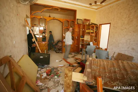 Palestinians search through rubble of their destroyed houses hit by Israeli strikes in Khuzaa, east of Khan Younis, in the northern Gaza Strip, Tuesday, Aug. 5, 2014. Israel and Hamas began observing a temporary cease-fi...