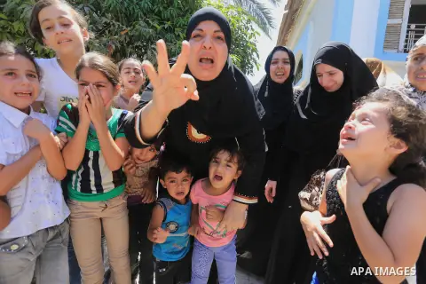 Palestinian relatives mourn the body of Palestinian of Al-Quds brigades, the military wing of Islamic Jihad, Shaban Al-Dahdouh, during his funeral in Gaza City, 06 August 2014. For the first time in nearly a month, the g...