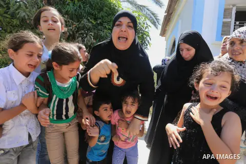 Palestinian relatives mourn the body of Palestinian of Al-Quds brigades, the military wing of Islamic Jihad, Shaban Al-Dahdouh, during his funeral in Gaza City, 06 August 2014. For the first time in nearly a month, the g...
