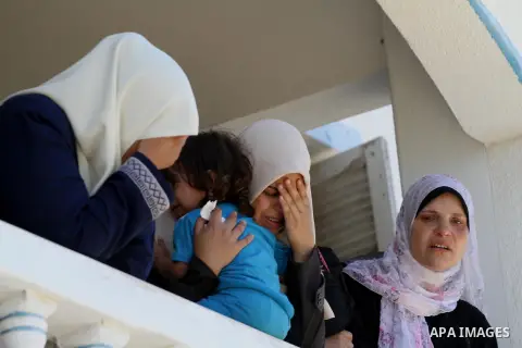 Palestinian relatives mourn the body of Palestinian of Al-Quds brigades, the military wing of Islamic Jihad, Shaban Al-Dahdouh, during his funeral in Gaza City, 06 August 2014. For the first time in nearly a month, the g...