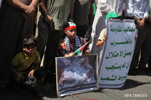 Palestinian protesters take part in a demonstration in support of the negotiator delegation in Cairo and the Palestinian resistance, in Gaza city on August 07, 2014. Indirect Israeli-Palestinian negotiations over extendi...