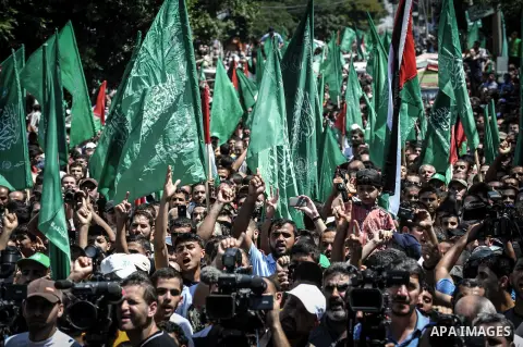 Palestinian demonstrators attend a rally in support of the Hamas movement in downtown Gaza City on August 07, 2014, while diplomatic efforts entered a final countdown in Cairo as Egyptian mediators rushed to broker an ex...